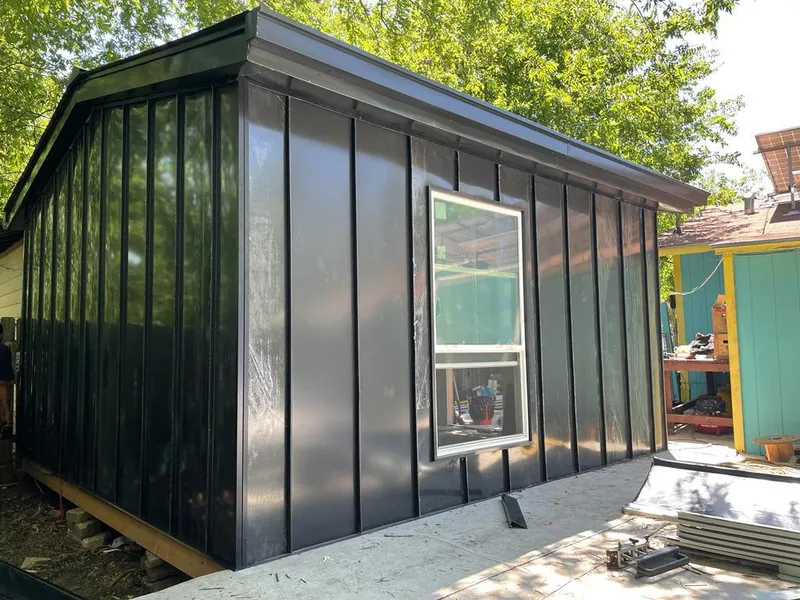 Black standing seam metal wall panels for Roof Inspection in St. Louis