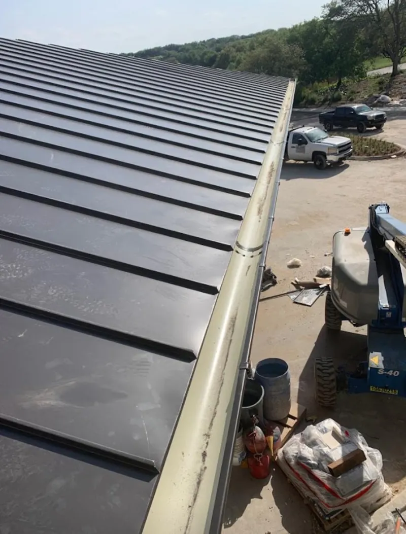 Standing seam panel and gutter detail on a metal roofing jobsite in St. Louis